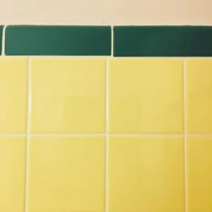 Green and yellow tiling inside of The Holiday