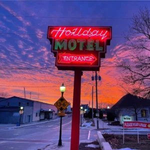 Holiday Music Motel's iconic neon sign at sunset in wintertime