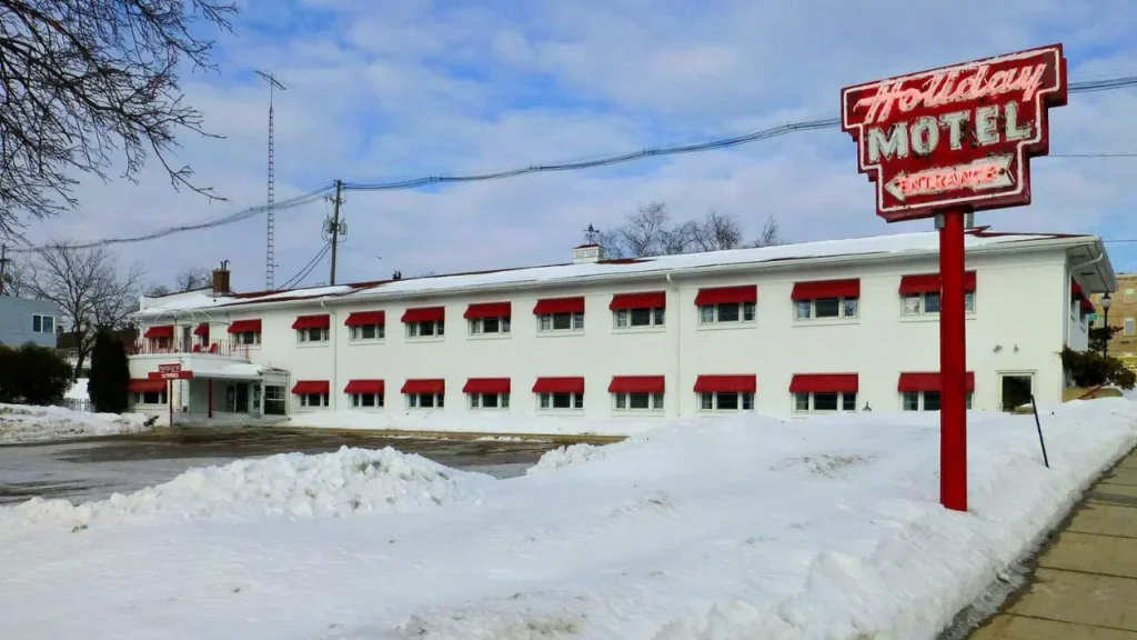 Snow covered Holiday Music Motel facade