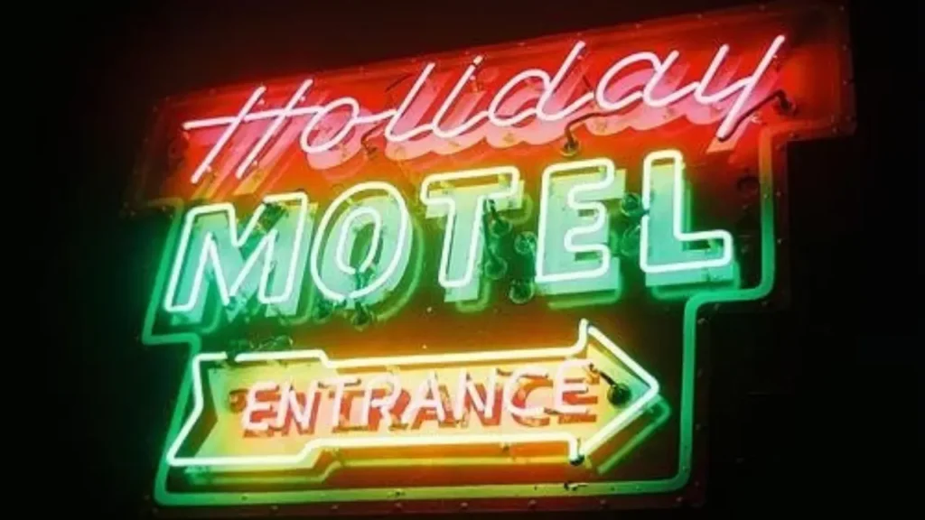 Holiday Music Motel neon sign at night