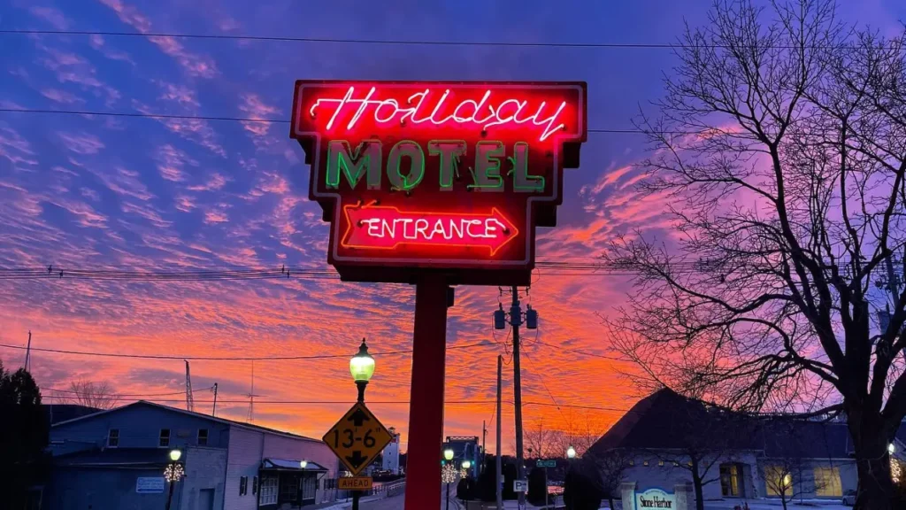 Holiday neon sign in winter during sunset