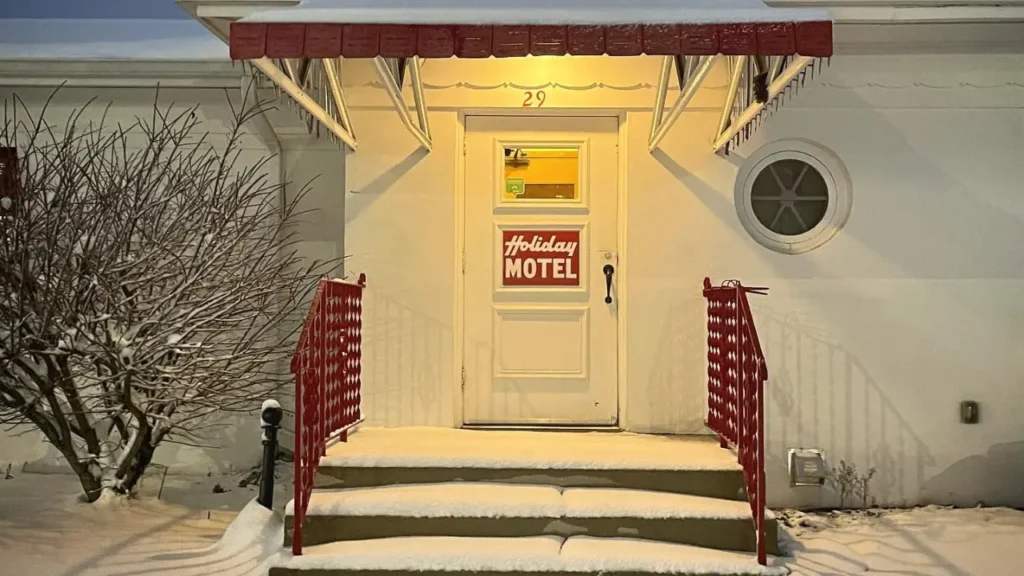 Holiday Motel door with layer of snow
